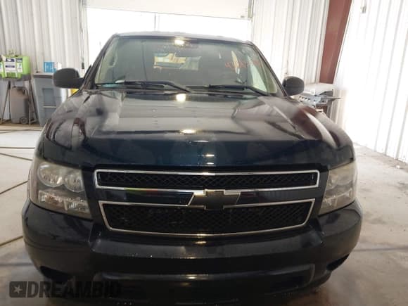 ✅ 2014 Chevrolet Tahoe Commercial • VIN: 1GNLC2E07ER213191 • Lot: 43243599. Listed on IAAI with 141,185 mi. Free auction sales archive from the USA and detailed vehicle history report at DreamBid. Image 11.