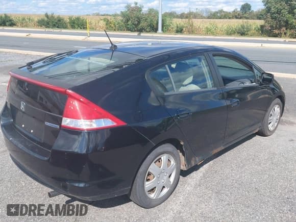 ✅ 2010 Honda Insight LX • VIN: JHMZE2H59AS000393 • Lot: 84609595. Wystawiony na Copart z przebiegiem 281 522 mil. Bezpłatny archiwum sprzedaży aukcyjnych z USA i szczegółowy raport historii pojazdu na DreamBid. Zdjęcie 4.