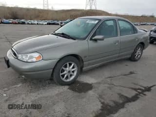 ✅ 1999 Ford Contour LX • VIN: 1FAFP66L5XK215968 • Лот: 46002715. Опубликован ранее на Copart с пробегом 55 822 миль. Бесплатный доступ к архиву аукционных продаж из США и подробный отчёт об истории автомобиля на DreamBid. Изображение 1.