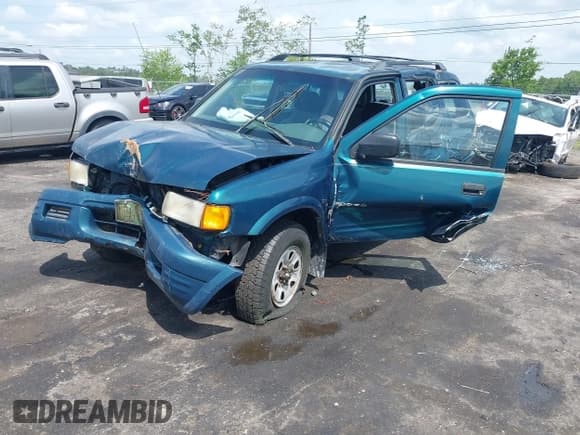 ✅ 1999 Isuzu Rodeo S • VIN: 4S2CK58W6X4332027 • Lot: 42087396. Listed on IAAI with 258,508 mi. Free auction sales archive from the USA and detailed vehicle history report at DreamBid. Image 16.