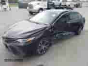 2019 Toyota Camry LE with VIN 4T1B11HK2KU833243, listed as a IAAI auction lot 42855313 with 128,404 mi miles and . Bid and sale history available at DreamBid. Image 2.