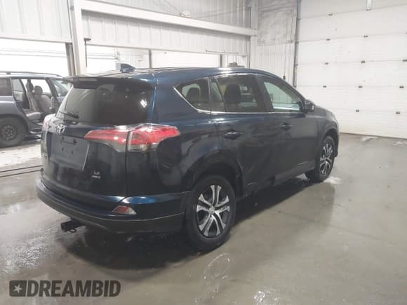 ✅ 2018 Toyota RAV4 LE • VIN: 2T3BFREV6JW767297 • Lot: 43736278. Listed on IAAI with 99,323 mi. Free auction sales archive from the USA and detailed vehicle history report at DreamBid. Image 4.