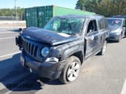 ✅ 2014 Jeep Patriot Latitude • VIN: 1C4NJRFB3ED821044 • Lot: 43503686. Listed on IAAI with 185,115 mi. Free auction sales archive from the USA and detailed vehicle history report at DreamBid. Image 2.