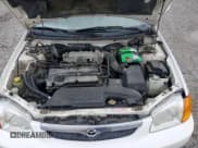 ✅ 2000 Mazda Protege DX • VIN: JM1BJ2223Y0295154 • Lot: 79511954. Wystawiony na Copart z przebiegiem 116 781 mil. Bezpłatny archiwum sprzedaży aukcyjnych z USA i szczegółowy raport historii pojazdu na DreamBid. Zdjęcie 11.