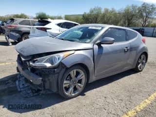 2017 Hyundai Veloster Value Edition с VIN KMHTC6AD6HU314275, выставлен на аукционе Copart как лот 80178065 с пробегом 57 199 миль миль и Списание • Salvage title. История ставок и продаж доступна на DreamBid. Изображение 1.