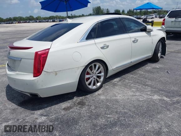 ✅ 2014 Cadillac XTS Luxury • VIN: 2G61M5S33E9326484 • Lot: 43119276. Listed on IAAI with 99,833 mi. Free auction sales archive from the USA and detailed vehicle history report at DreamBid. Image 4.
