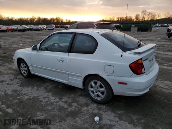 2003 Hyundai Accent GL with VIN KMHCG35C53U258469, listed as a Copart auction lot 82977294 with 99,136 mi miles and Clean title. Bid and sale history available at DreamBid. Image 2.