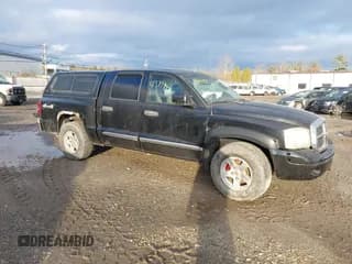 ✅ 2005 Dodge Dakota SLT • VIN: 1D7HW48NX5S227299 • Lot: 43797431. Listed on IAAI with 147,952 mi. Free auction sales archive from the USA and detailed vehicle history report at DreamBid. Image 1.
