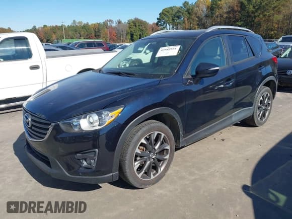 ✅ 2016 Mazda CX-5 Grand Touring • VIN: JM3KE2DY5G0715623 • Lot: 43582561. Wystawiony na IAAI z przebiegiem 166 935 mil. Bezpłatny archiwum sprzedaży aukcyjnych z USA i szczegółowy raport historii pojazdu na DreamBid. Zdjęcie 17.