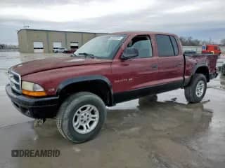 2002 Dodge Dakota SLT z VIN 1B7HG48N32S615218, wystawiony jako Copart lot #58251685 z przebiegiem Nie podano mil oraz Szkoda całkowita • Salvage title. Historia ofert i sprzedaży dostępna na DreamBid. Obrazek 1.