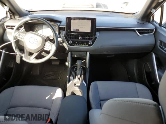 ✅ 2023 Toyota Corolla Cross Hybrid S • VIN: 7MUFBABG6PV005267 • Lot: 85154915. Listed on Copart with 10,524 mi. Free auction sales archive from the USA and detailed vehicle history report at DreamBid. Image 8.