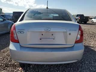 2008 Hyundai Accent GLS z VIN KMHCN46C98U240090, wystawiony jako Copart lot #77001554 z przebiegiem 125 897 mil mil oraz Szkoda całkowita • Salvage title. Historia ofert i sprzedaży dostępna na DreamBid. Obrazek 6.