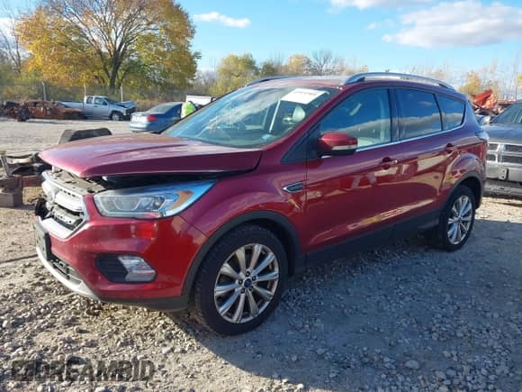 2017 Ford Escape Titanium z VIN 1FMCU9J94HUA64108, wystawiony jako IAAI lot #43571909 z przebiegiem 209 412 mil mil oraz . Historia ofert i sprzedaży dostępna na DreamBid. Obrazek 2.