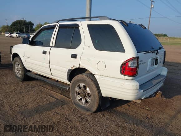 ✅ 2000 Isuzu Rodeo S • VIN: 4S2CK58W1Y4323057 • Lot: 43357739. Listed on IAAI with 147,414 mi. Free auction sales archive from the USA and detailed vehicle history report at DreamBid. Image 3.