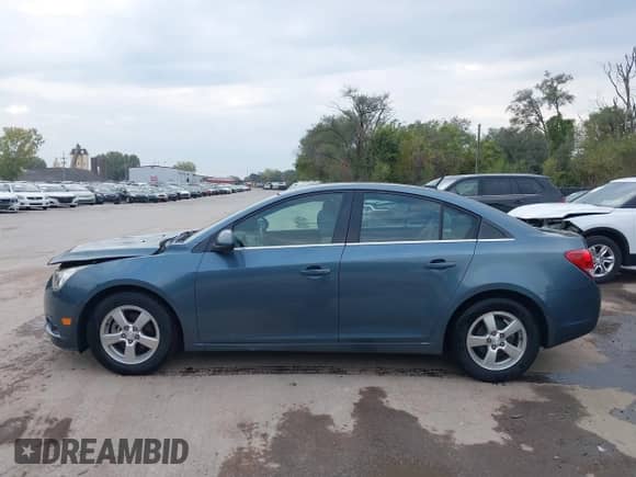 2012 Chevrolet Cruze 1LT z VIN 1G1PF5SC5C7240568, wystawiony jako IAAI lot #43441891 z przebiegiem 100 950 mil mil oraz . Historia ofert i sprzedaży dostępna na DreamBid. Obrazek 14.
