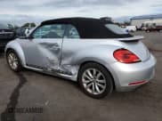 ✅ 2014 Volkswagen Beetle 2.0L TDI • VIN: 3VW5L7AT9EM813384 • Lot: 81159585. Listed on Copart with 117,083 mi. Free auction sales archive from the USA and detailed vehicle history report at DreamBid. Image 2.