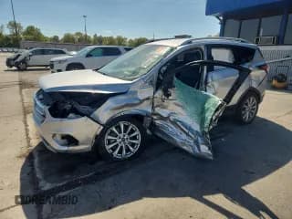 ✅ 2017 Ford Escape Titanium • VIN: 1FMCU9JD6HUC86315 • Lot: 80129955. Wystawiony na Copart z przebiegiem 88 473 mil. Bezpłatny archiwum sprzedaży aukcyjnych z USA i szczegółowy raport historii pojazdu na DreamBid. Zdjęcie 1.