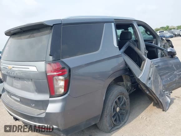✅ 2021 Chevrolet Tahoe LT • VIN: 1GNSKNKD9MR240236 • Lot: 42302155. Listed on IAAI with 84,897 mi. Free auction sales archive from the USA and detailed vehicle history report at DreamBid. Image 4.