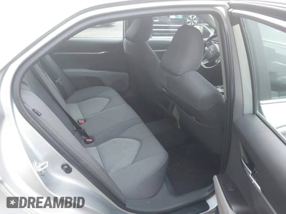 2022 Toyota Camry LE with VIN 4T1R11BKXNU066513, listed as a IAAI auction lot 41324509 with 19,488 mi miles and . Bid and sale history available at DreamBid. Image 3.