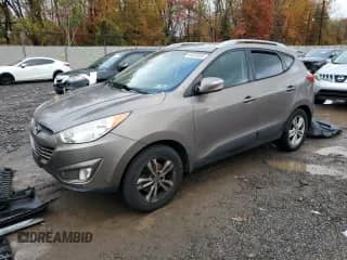 2013 Hyundai Tucson GLS with VIN KM8JUCAC5DU566734, listed as a Copart auction lot 90823465 with 170,827 mi miles and Clean title. Bid and sale history available at DreamBid. Image 1.