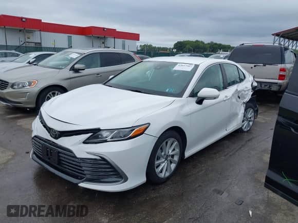 2022 Toyota Camry LE with VIN 4T1R11BK3NU064246, listed as a IAAI auction lot 43037907 with 64,971 mi miles and . Bid and sale history available at DreamBid. Image 17.