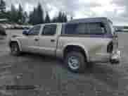 2002 Dodge Dakota SLT с VIN 1B7HL48N02S607590, выставлен на аукционе Copart как лот 78642324 с пробегом 209 081 миль миль и Списание • Salvage title. История ставок и продаж доступна на DreamBid. Изображение 2.