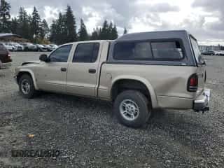 2002 Dodge Dakota SLT с VIN 1B7HL48N02S607590, выставлен на аукционе Copart как лот 78642324 с пробегом 209 081 миль миль и Списание • Salvage title. История ставок и продаж доступна на DreamBid. Изображение 2.