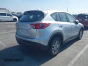 ✅ 2016 Mazda CX-5 Sport • VIN: JM3KE2BY4G0845816 • Lot: 42333248. Listed on IAAI with 48,504 mi. Free auction sales archive from the USA and detailed vehicle history report at DreamBid. Image 4.