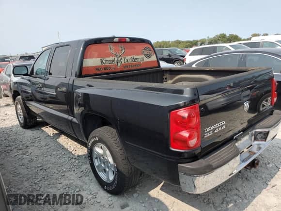 2007 Dodge Dakota SLT z VIN 1D7HW48P37S216293, wystawiony jako Copart lot #70383244 z przebiegiem Nie podano mil oraz Szkoda całkowita • Salvage title. Historia ofert i sprzedaży dostępna na DreamBid. Obrazek 2.