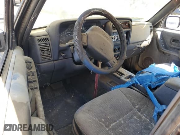 ✅ 1999 Jeep Cherokee Sport • VIN: 1J4FT68S0XL555883 • Lot: 51016255. Listed on Copart with 128,306 mi. Free auction sales archive from the USA and detailed vehicle history report at DreamBid. Image 8.