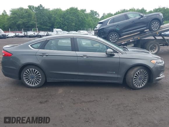 ✅ 2018 Ford Fusion Titanium • VIN: 3FA6P0RU6JR123840 • Lot: 42536431. Listed on IAAI with 106,734 mi. Free auction sales archive from the USA and detailed vehicle history report at DreamBid. Image 13.