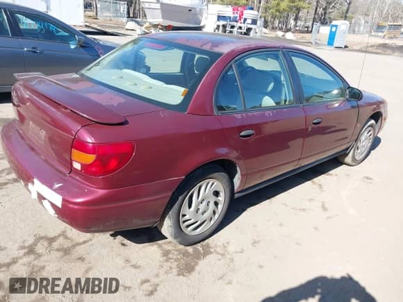 2002 Saturn SL z VIN 1G8ZF52852Z267004, wystawiony jako IAAI lot #41760974 z przebiegiem 228 165 mil mil oraz . Historia ofert i sprzedaży dostępna na DreamBid. Obrazek 4.