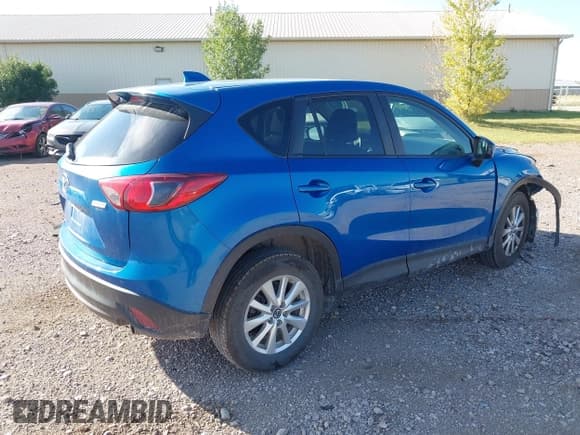 ✅ 2013 Mazda CX-5 Touring • VIN: JM3KE4CE8D0102801 • Lot: 43206563. Listed on IAAI with 149,282 mi. Free auction sales archive from the USA and detailed vehicle history report at DreamBid. Image 4.