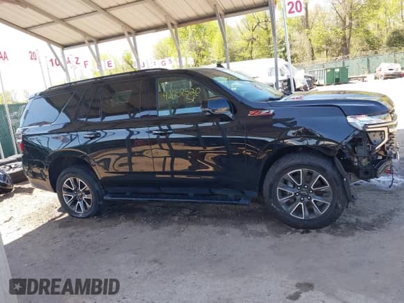 2022 Chevrolet Tahoe Z71 z VIN 1GNSKPKD1NR242429, wystawiony jako IAAI lot #42058520 z przebiegiem 63 699 mil mil oraz . Historia ofert i sprzedaży dostępna na DreamBid. Obrazek 13.