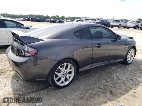 2008 Hyundai Tiburon GT с VIN KMHHN66F58U284485, выставлен на аукционе Copart как лот 61948765 с пробегом 134 445 миль миль и Списание • Salvage title. История ставок и продаж доступна на DreamBid. Изображение 3.