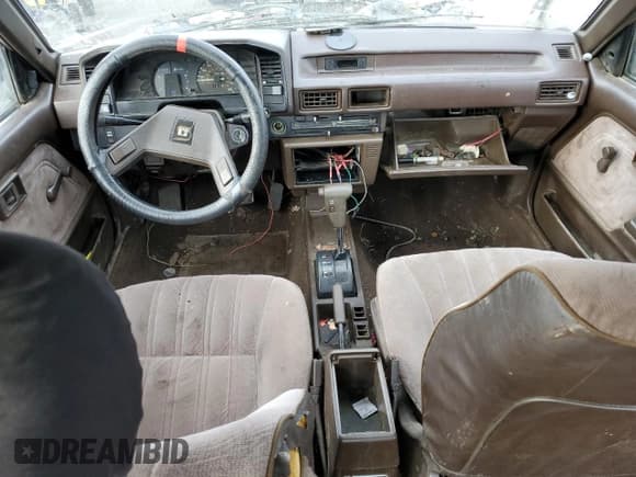 ✅ 1986 Toyota Corolla • VIN: JT2AE83L6G3356299 • Лот: 83918494. Опубликован ранее на Copart с пробегом 479 909 миль. Бесплатный доступ к архиву аукционных продаж из США и подробный отчёт об истории автомобиля на DreamBid. Изображение 8.