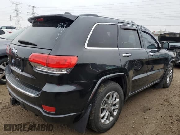 ✅ 2015 Jeep Grand Cherokee Overland • VIN: 1C4RJFCM7FC880093 • Lot: 82241784. Listed on Copart with 158,346 mi. Free auction sales archive from the USA and detailed vehicle history report at DreamBid. Image 3.
