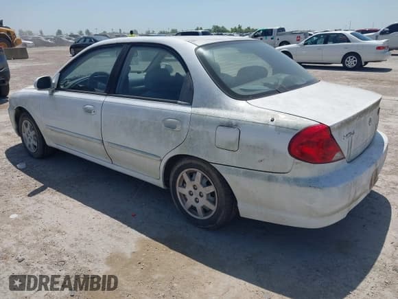 ✅ 2003 Kia Spectra • VIN: KNAFB121X35225904 • Lot: 42777789. Wystawiony na IAAI z przebiegiem 168 628 mil. Bezpłatny archiwum sprzedaży aukcyjnych z USA i szczegółowy raport historii pojazdu na DreamBid. Zdjęcie 3.