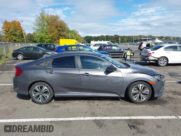 ✅ 2016 Honda Civic EX-T • VIN: 2HGFC1F30GH659017 • Лот: 43399280. Опубликован ранее на IAAI с пробегом 148 200 миль. Бесплатный доступ к архиву аукционных продаж из США и подробный отчёт об истории автомобиля на DreamBid. Изображение 13.