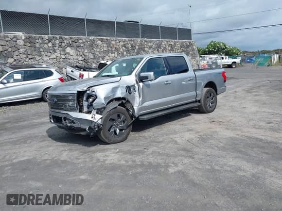 ✅ 2023 Ford F-150 Lightning Pro • VIN: 1FT6W1EV8PWG59244 • Lot: 42631226. Listed on IAAI with 13,682 mi. Free auction sales archive from the USA and detailed vehicle history report at DreamBid. Image 2.