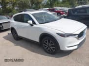 ✅ 2017 Mazda CX-5 Grand Touring • VIN: JM3KFBDL0H0210818 • Lot: 43203471. Wystawiony na IAAI z przebiegiem 104 966 mil. Bezpłatny archiwum sprzedaży aukcyjnych z USA i szczegółowy raport historii pojazdu na DreamBid. Zdjęcie 1.