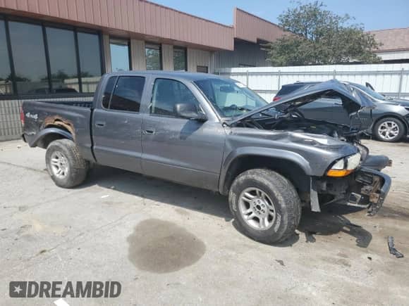 2003 Dodge Dakota Sport z VIN 1D7HG38N93S323350, wystawiony jako Copart lot #68911784 z przebiegiem 137 395 mil mil oraz Czysty tytuł • Clean title. Historia ofert i sprzedaży dostępna na DreamBid. Obrazek 4.