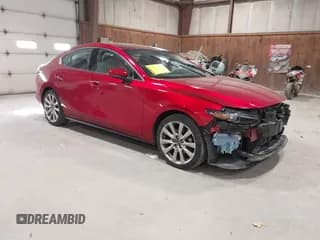 ✅ 2021 Mazda 3 • VIN: JM1BPBDL0M1334811 • Lot: 43777630. Listed on IAAI with 57,584 mi. Free auction sales archive from the USA and detailed vehicle history report at DreamBid. Image 1.