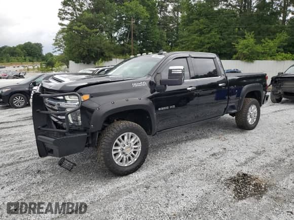 2022 Chevrolet Silverado 2500HD High Country with VIN 1GC4YREY8NF203395, listed as a Copart auction lot 58822955 with 129,552 mi miles and Salvage title. Bid and sale history available at DreamBid. Image 1.