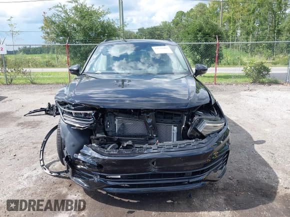 ✅ 2024 Volkswagen Tiguan SE R-Line Black • VIN: 3VVCB7AX9RM199007 • Lot: 42670002. Listed on IAAI with 11,298 mi. Free auction sales archive from the USA and detailed vehicle history report at DreamBid. Image 12.