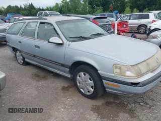 ✅ 1990 Mercury Sable • VIN: 1MECM55U5LA600326 • Lot: 42629859. Wystawiony na IAAI z przebiegiem 64 312 mil. Bezpłatny archiwum sprzedaży aukcyjnych z USA i szczegółowy raport historii pojazdu na DreamBid. Zdjęcie 1.