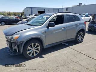 2013 Mitsubishi Outlander LE with VIN 4A4AR5AU8DE024525, listed as a Copart auction lot 65474335 with 128,313 mi miles and Salvage title. Bid and sale history available at DreamBid. Image 1.
