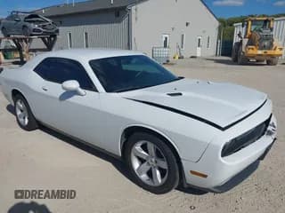 ✅ 2013 Dodge Challenger SXT • VIN: 2C3CDYAG4DH670216 • Lot: 43435221. Listed on IAAI with 188,060 mi. Free auction sales archive from the USA and detailed vehicle history report at DreamBid. Image 1.