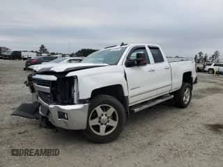 2015 Chevrolet Silverado 2500HD LTZ with VIN 1GC2KWE89FZ554016, listed as a Copart auction lot 83434944 with 239,459 mi miles and Salvage title. Bid and sale history available at DreamBid. Image 1.