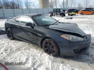 2007 Hyundai Tiburon GT z VIN KMHHN66F87U252127, wystawiony jako Copart lot #43349365 z przebiegiem 186 319 mil mil oraz Czysty tytuł • Clean title. Historia ofert i sprzedaży dostępna na DreamBid. Obrazek 4.